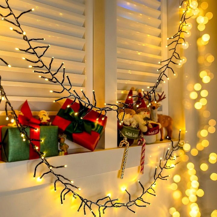 Ollny 600 LED 9m Christmas Warm White Cluster Lights (Green Cable, Plug in, 8 Modes)